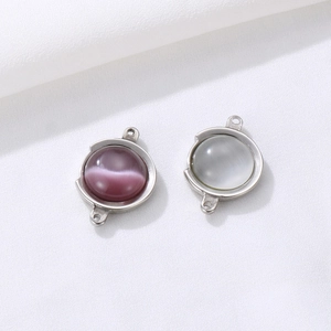 DIY round stainless steel gemstone pendants with purple and grey cat-eye stone detail
