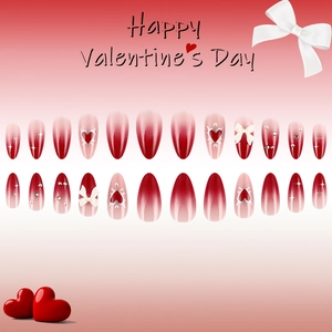 Red almond press-on nails with 3D white butterfly accents and heart pattern