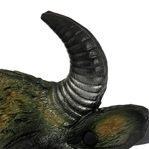 Detail of 3D buffalo mask showing realistic horn texture and green wrinkled skin patterns