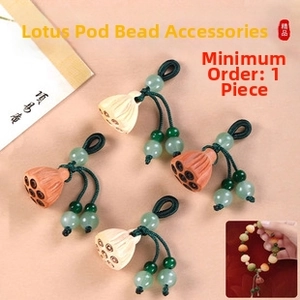 Detailed lotus pod pendants for DIY jewelry making with smooth wood texture and green beads