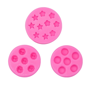 Detailed macro view of pink silicone molds for DIY mini cakes and fondant decorations