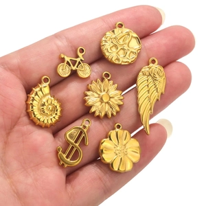 Stainless steel gold charms set featuring bicycle shell and sunflower for jewelry making
