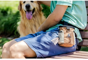 Khaki canvas pet treat bag with waste bag dispenser and side mesh pocket worn on waist
