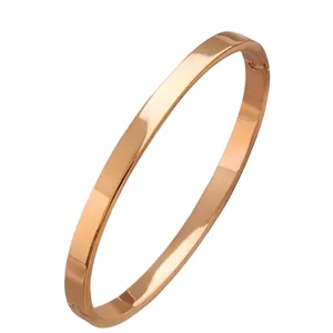 Rose gold stainless steel bangle with polished mirror finish in a minimalist style