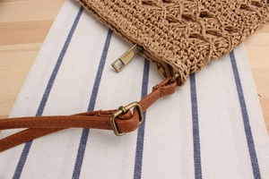 Macro detail of hand-woven paper rope texture with premium brown faux leather strap buckle