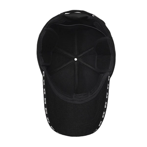 Inside view of a black winter baseball cap showing reinforced seams and thermal ear flaps