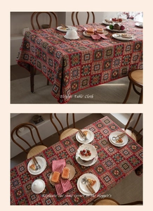 Close-up of red festive tablecloth with intricate geometric jacquard embroidery details