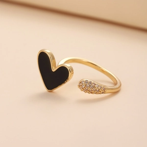 Minimalist gold open ring featuring a black enamel heart and shimmering pave zircons