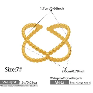 Detail of waterproof gold beaded cross ring with hypoallergenic size and weight specs