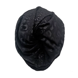 Fashionable black leopard jacquard beanie with twisted center design for men and women