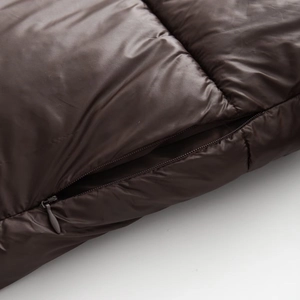 Deep brown quilted jacket with high collar and hidden zipper detail for winter