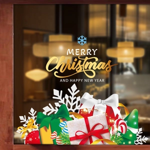 Festive Christmas window decals featuring snowflakes and gift boxes on glass background