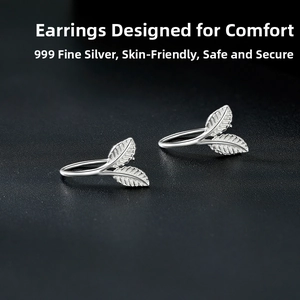 Close-up of S999 sterling silver ginkgo leaf earrings with detailed vein texture