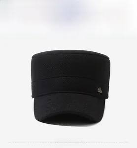 Detail view of black herringbone military cap for men with mountain metal logo