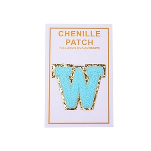 Blue chenille letter W patch with gold sequins and peel and stick adhesive backing