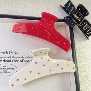 Elegant acetate claw clips with colorful rhinestones in red, white and black colors