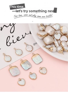 Detail of irregular freshwater pearl pendants with gold-plated edges in various shapes