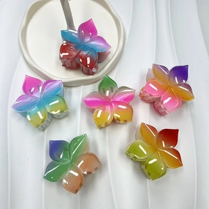 Set of six rainbow gradient flower hair claws in polished resin for holiday styling