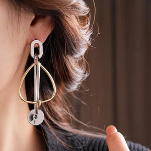 Modern gold and silver mixed metal geometric drop earrings with elegant dangling style