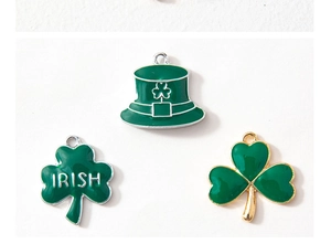 Detailed shot of St. Patrick's Day charms featuring Irish shamrocks and green enamel hats