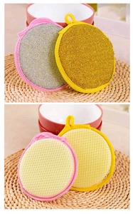 Detail of round double-sided dish sponges with gold and silver scrubbing wire surface