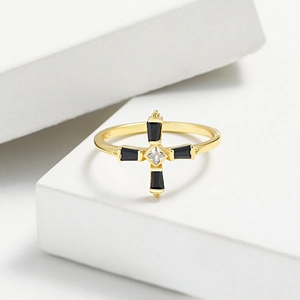 Detailed macro view of S925 silver cross ring with black gemstones and clear zircon