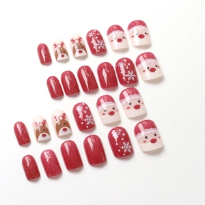 Christmas press-on nails set with red reindeer patterns and white snowflakes designs