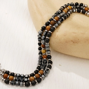 Three-layer men's beaded bracelet featuring brown agate, black lava stone, and geometric metal beads