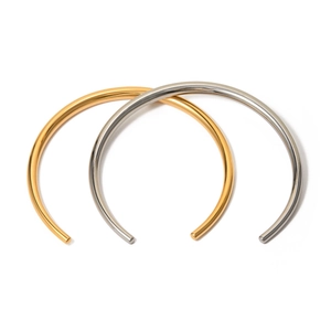 Minimalist 18k gold and silver stainless steel open bangles on a white background