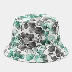 Close-up of mint green eucalyptus leaf print on a reversible cotton sun bucket hat
