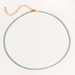 Detail of gold chain necklace featuring turquoise beads with lobster clasp and extender