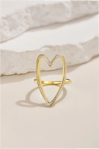 Close-up of gold S925 silver hollow heart ring with sparkling pave cubic zirconia