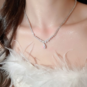 Close-up of elegant silver water drop zircon necklace with shimmering crystal stones