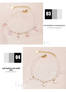 Detail of gold stainless steel pearl bracelets with pink moon and star enamel charms