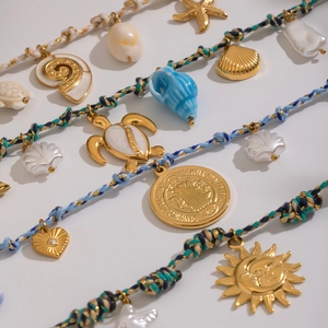 Bohemian handmade woven cord necklace with gold sea turtle, starfish and heart charms