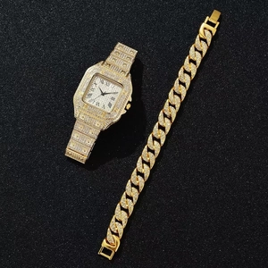 Detailed view of luxury gold square watch and diamond-encrusted Cuban bracelet set