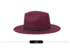 Side view of a burgundy fedora hat with a black rhinestone embellished band decoration