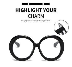 Detailed view of the hinge and glossy black frame of the oversized round glasses