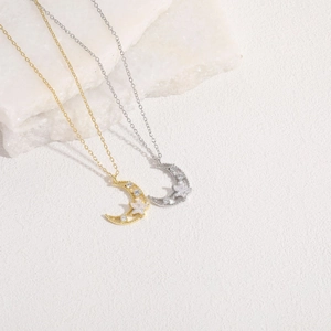Minimalist 14K gold plated necklace with moon and star zircon pendants on stone