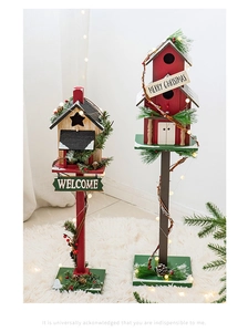 Close-up of wooden Christmas birdhouse decor with pine needles and LED lights