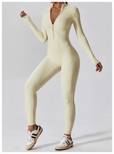 Detail of front half-zipper and high collar on cream long sleeve yoga bodysuit