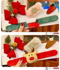Detailed view of Christmas hair accessories set with velvet bows and elk antlers