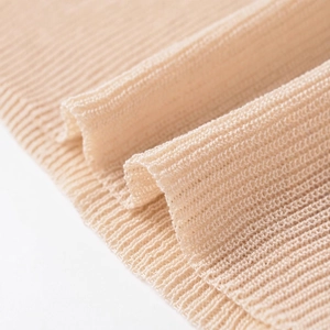 Chic beige mock neck knit top featuring a detailed ribbed texture and soft drape