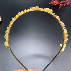 Detailed view of handmade gold wire crown headband with yellow crystal stone chips
