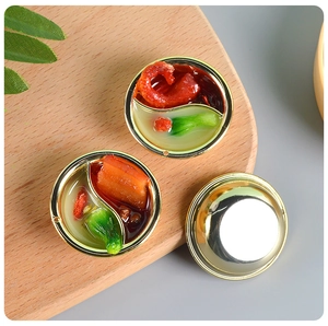 Detailed macro view of a miniature dollhouse hot pot model with realistic food elements