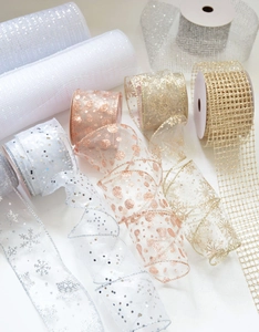 Detail of assorted sparkling chiffon ribbons with sequins and snowflakes for Christmas decor