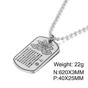 Detail of silver lotus flower and Heart Sutra engraving on a steel dog tag necklace