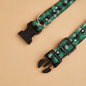 Detail of Christmas plaid pet collar with snowflake pattern and sturdy metal D-ring buckle