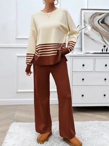Detailed texture of beige and brown striped knit sweater with matching wide-leg trousers