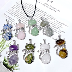 Detail of cat shaped necklace pendants with various colorful natural gemstones inlay